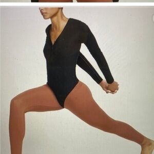 NWOT Nike Yoga Luxe Long sleeve black bodysuit medium